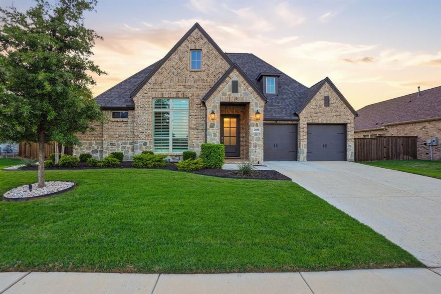 Built by Perry Homes and designed for elevated living, this one-story home in the prestigious Watercress neighborhood offers 2994 square feet of thoughtfully-crafted living space featuring four bedrooms with study option, three full bathrooms, a chef's kitchen with dining area, an oversized living area, a private game-media room with French doors, a MUD-utility area and a tandem three-car garage. Clean architectural lines, a plethora of upgrades, and modern finishes define the home's sophisticated style. The chef's kitchen anchors the home with lovely quartz counters, Herringbone backsplash, an expansive center island, top-of-the-line GE appliances including a five-burner gas cook-top, upgraded cabinetry and an elegant dining area surrounded by windows. Open to the kitchen, the oversized family room boasts a raised ceiling, a wall of windows, and a stately stacked stone fireplace. The backyard patio presents an upgraded remote-controlled outdoor screen dissolving boundaries between inside and out. Plantation shutters, custom shades, wood-inspired tile flooring, modern fixtures and upgraded hardware elevate the home with timeless sophistication. A thoughtfully designed flex room with French doors adds versatility to the floor plan. Seamlessly adapting to one's lifestyle, this room could be used for entertainment, work, wellness, or creative pursuits. The three-car, tandem garage ensures both function and ease of living. Additional amenities include automatic shades, plantation shutters, custom landscape, professional up-down lighting, tankless water heater, an upgraded breaker box with surge protection, Radiant Barrier insulation and more. Watercress residents enjoy exclusive access to a resort-style pool, covered pavilion with fireplace, sink and grills, playground and stocked ponds for fishing.  This home feeds the award-winning Northwest ISD and is located just a short commute to downtown Fort Worth and the upscale shopping and restaurants at Alliance Town Center.