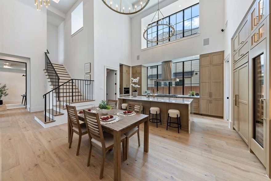 ASK ABOUT THE BUYER CREDIT! Located in The Fields, Frisco’s premier community next to the PGA headquarters, this premium corner-lot home is the only move-in ready Huntington Sebastian floor plan available, offering park views and timeless sophistication. Loaded with extensive builder and designer upgrades, this home offers exceptional quality and luxurious finishes. Just minutes from the upcoming Universal Studios, it blends functionality and convenience. A standout feature is the detached casita with its own private entrance - perfect for hosting guests, extended family, or a private workspace. Step through grand double glass doors into a stunning foyer with soaring 22-foot ceilings, beam accents, and expansive windows that flood the open-concept layout with natural light. Multiple 10-foot sliding glass doors create a seamless indoor-outdoor flow, ideal for entertaining. At the heart of the home, a chef’s kitchen boasts Wolf appliances, a Sub-Zero fridge, two wine refrigerators, a built-in Miele coffee station, handcrafted cabinetry, quartz countertops, and a separate prep kitchen with an additional Sub-Zero fridge and dishwasher. The primary suite is a spa-like retreat with a freestanding soaking tub, oversized shower with multiple shower heads, dual sinks with backlit mirrors, and a spacious custom walk-in closet. Each additional bedroom is en-suite for ultimate privacy and comfort. A glass-enclosed study provides inspiring views of the patio, while the upstairs game room, media room, and sleek wet bar with Wolf and Sub-Zero appliances cater to elevated entertaining. Smart home features include integrated security and whole-home audio, extending to the outdoor living spaces. The fully equipped outdoor kitchen with a Wolf grill, fridge, sink, and fireplace invites year-round al fresco gatherings, with a backyard ready for your custom pool. This home is luxury redefined, offering unmatched access to world-class golf, dining, and entertainment.