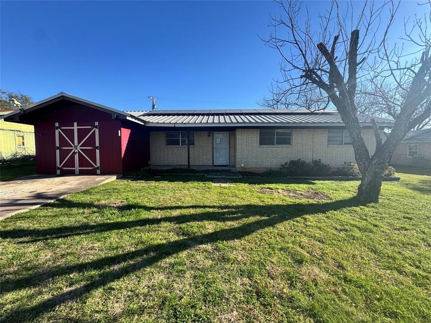 Charming 2 bedroom, 2 bathroom brick home located near Lake Brownwood offering comfort, functionality, and great storage. The living room flows seamlessly into the dining area and kitchen, creating an open and inviting space perfect for everyday living or entertaining. A wood-burning fireplace adds warmth and character to the main living area.

Just off the kitchen you’ll find a separate utility room for added convenience. Down the hallway are two bedrooms, including the primary bedroom featuring a walk-in closet and private bathroom.

Outside, the property offers a partially fenced backyard and an attached storage shed, providing plenty of space for tools, outdoor gear, or lake essentials. The home is also equipped with solar panels, helping provide added energy efficiency.

Conveniently located just minutes from Lake Brownwood, this property would make a great full-time residence, weekend getaway, or investment opportunity.