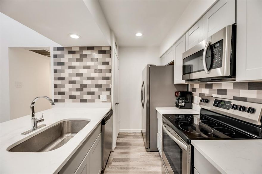 Welcome to this charming two-bedroom, two-bathroom completely remodeled condo features cozy, comfortable city living. As you step inside, discover the seamless open living that effortlessly combines living, dining, & kitchen areas, creating an expansive & airy atmosphere. You will be greeted by the inviting vaulted ceilings that amplify the sense of space and natural light. The kitchen boasts stainless steel appliances, breakfast bar, perfect blend of form & function. The layout emphasizes functionality and style, with two generously sized bedrooms offering ample space for rest and relaxation. The bathrooms are designed with modern convenience in mind, ensuring comfort and privacy for residents and guests alike. A private back balcony offers a tranquil retreat, perfect for morning coffees or evening relaxation. Quiet complex with a pool and walking trails. So close to so much shopping and other amenities. Two dedicated covered parking spaces are included. This is a must-see!