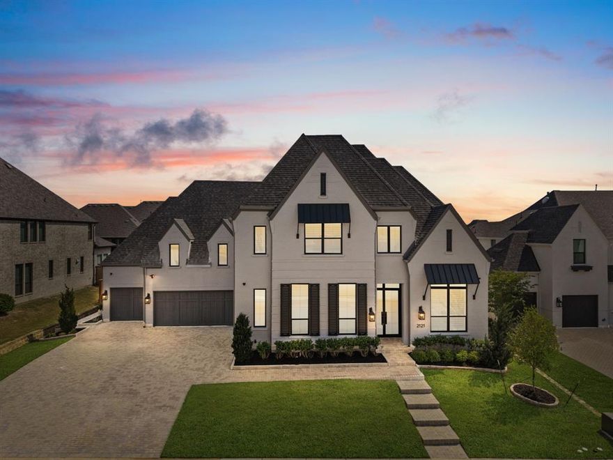Welcome to an exquisite luxury estate, perfectly situated on an expansive lot in the highly sought after community of Mustang Lakes. This remarkable custom-built home offers over 4,500 square feet of refined living space with thoughtful upgrades throughout, $41K PID paid in full. Elegance meets comfort with rich hardwood flooring throughout the home, five spacious ensuite bedrooms, and eight luxurious baths, including three powder rooms. The gourmet kitchen is a chef’s dream, featuring beamed, vaulted ceilings, a dramatic waterfall-edge quartz island, professional-grade GE Monogram appliances, Air fry mode on the French oven, double dishwashers, & sleek custom cabinetry that extends to the ceiling. A spacious walk-in pantry and separate bar offer versatile storage space that enhances kitchen efficiency. The living room is inviting and open, with natural light flooding through and highlighting the custom fireplace and beamed ceiling. Entertain effortlessly with a main-level media room plus an upstairs gameroom. A dedicated office with built ins provides a private retreat for working remotely. Outdoor entertaining is a breeze with two covered outdoor living areas overlooking a spacious backyard. The oversized 4-car garage with epoxy flooring ensures room for everyone's vehicle plus storage.. This home is a masterpiece of modern luxury, boasting smart home technology, a hardwired Ring camera, alarm system, & solar panel conduit installation. Newly redone landscaping enhances the exterior, while the interior showcases upgrades like a double washer and dryer in laundry room & a double shower head in primary bath. The whole-home water filtration system ensures purity & peace of mind. Mustang Lakes offers exceptional amenities including resort-style pools, tennis & basketball courts, fitness center, clubhouse, trails, ponds, & parks, all in the highly regarded Prosper ISD & Walnut Grove HS zone. See list of upgrades in Transaction Desk.