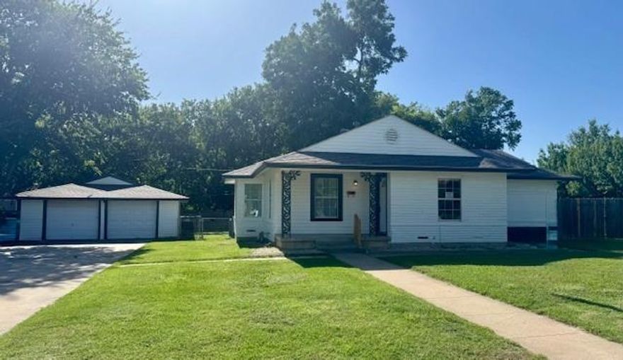 Ample corner lot with extra-large driveway plus an additional side driveway with separate side gated access to park a boat or extra vehicles in the back. 
The house has stand out curb appeal with a covered front porch and fresh coat of exterior paint. Three bedrooms share two full baths withstand up showers. Second living area could double as a guest room. New HVAC unit. Large utility room off the kitchen, too. Bring your paint brush and decorating ideas to make this house your home.