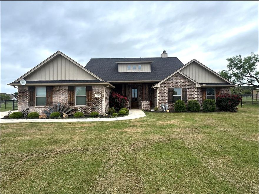 Welcome to 470 Wilson Bend Rd. in Millsap, Texas. Where character, craftsmanship, and outdoor living come together.
This beautifully maintained 4-bedroom, 2-bath home offers a functional layout designed for both everyday living and entertaining. Inside, you’ll immediately notice the home’s unique charm, featuring custom hand-troweled plaster walls with rich turquoise and copper patina tones, giving the home a distinctive old-world, artisan feel you rarely see.
The spacious kitchen offers ample cabinetry, a large island, and opens seamlessly to the main living and dining areas, creating a warm and inviting space for gatherings. Rustic details, beautiful wood beams, and thoughtful finishes throughout add to the home’s character.
The primary suite is designed with convenience in mind, featuring a laundry room that connects directly to the primary closet and bathroom, making daily routines effortless.
Step outside and discover an incredible backyard retreat. The extended covered patio overlooks the sparkling swimming pool, creating the perfect setting for relaxing evenings, entertaining guests, or enjoying warm Texas summers.
Additional features include a two-car garage, spacious secondary bedrooms, and a layout that balances comfort, style, and functionality.
Located in Millsap ISD with easy access to Weatherford, this home offers the perfect blend of small-town living and unique character.
If you’re looking for a home with personality, craftsmanship, and a backyard made for entertaining, this one is a must-see.