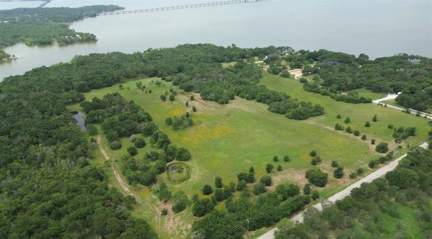 The most amazing waterfront development potential centrally located to all of every attraction that is within DFW! Or, an amazing waterfront ranch with sandy soil for your horses and ag exemption with mature, gorgeous trees on the lake.