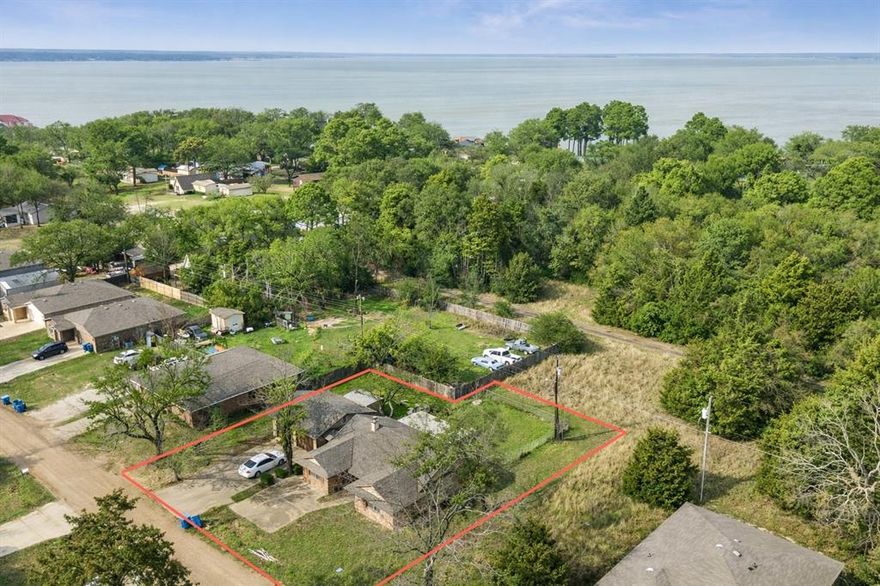 Investment opportunity or .48AC lot sale, just steps from the water in Loon Bay. Seller has thoughtfully remodeled both the kitchen and living room with vaulted ceilings and low maintenance finishes. Make this home your own with plenty of opportunity to put finishing touches on the bedrooms and bathrooms. Close to POA boat launch within the subdivision as well as shopping, groceries, dining and more. This is an As Is sale - seller will make no repairs.