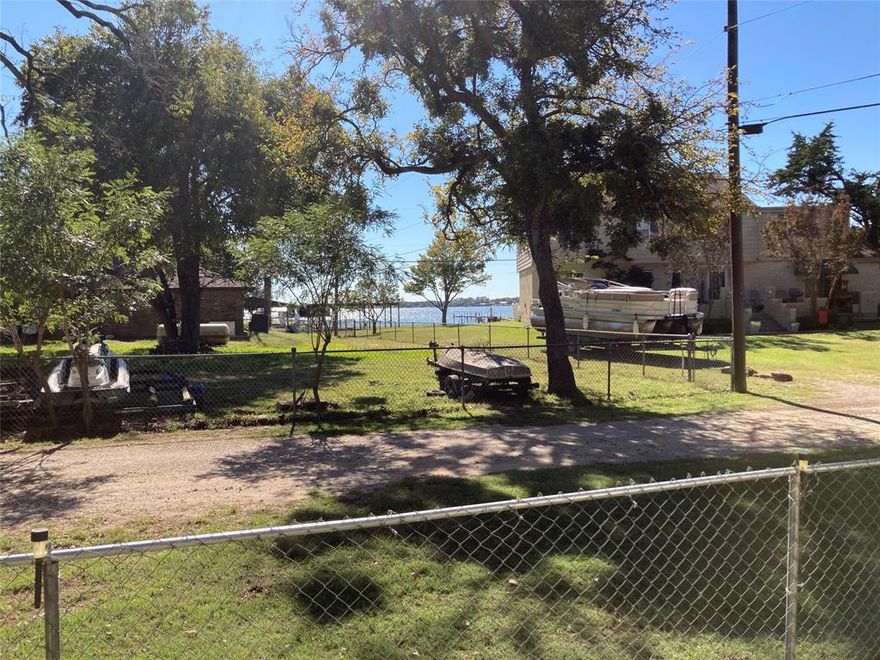 Welcome to 11655 Randle Ln—your chance to step into a true mid-century modern home with great bones and endless potential. This 3-bed, 2-bath, 1,752 sq ft two-story layout offers a smart setup with the primary bedroom and a full bath downstairs, plus two more bedrooms and another full bath upstairs for added separation and privacy. You’ll love the original wood floors, solid wood paneling that give the home its authentic character. The neighborhood itself is a rare find, with a mix of homes that even includes multi-million-dollar properties, giving the area a high-end feel while still staying relaxed and quiet
Sitting on a quiet .312 acre lot, you’ll instantly feel the peaceful, rural vibe the moment you arrive. Massive oak trees surround the property, creating natural shade and privacy, and there are even views of Eagle Mountain Lake to enjoy. It truly feels like an escape—yet you’re just minutes from the marina.
You’ll appreciate the freedom that comes with a private well, septic system, no HOA, and no city taxes—resulting in lower ongoing costs and more flexibility in how you use the property. Are you tired of cookie cutter properties. Act Quickly this type of home and this type of location doesn't come around very often.