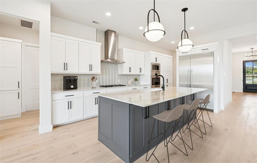 Luxury new construction in the heart of downtown Roanoke’s walkable dining district, offering executive-level design, energy-efficient performance, and exceptional value at $1,225,000.

This 4-bedroom, 4.1-bath residence spans 3,504 square feet of thoughtfully designed living space with high-end finishes and seamless indoor-outdoor flow. Expansive Andersen Low-E windows flood the open-concept main level with natural light. The living area is anchored by a dramatic floor-to-ceiling stone fireplace and oversized sliding glass doors opening to a covered patio—ideal for entertaining.

The chef’s kitchen features Bosch appliances, built-in refrigerator, oversized island with seating, and abundant custom cabinetry, balancing functionality with elevated design. A private office on the main level provides a dedicated work-from-home space.

The primary suite offers a refined retreat with large picture windows and a spa-inspired bath complete with dual vanities, freestanding soaking tub, expansive walk-in shower, and dual closets. A secondary bedroom suite downstairs adds flexibility for guests or multigenerational living.

Upstairs includes two additional bedrooms, a spacious gameroom, flex nook, and additional storage, creating smart separation of space.

Built for long-term efficiency and comfort, the home includes full encapsulation, Rinnai tankless water heater, smart thermostats, 16 SEER HVAC system, and premium Andersen Low-E windows.

Located just moments from Roanoke’s renowned dining, boutique shopping, award-winning schools, and convenient commuter access, this residence offers modern luxury, walkability, and compelling value in one of North Texas’ most desirable lifestyle communities.