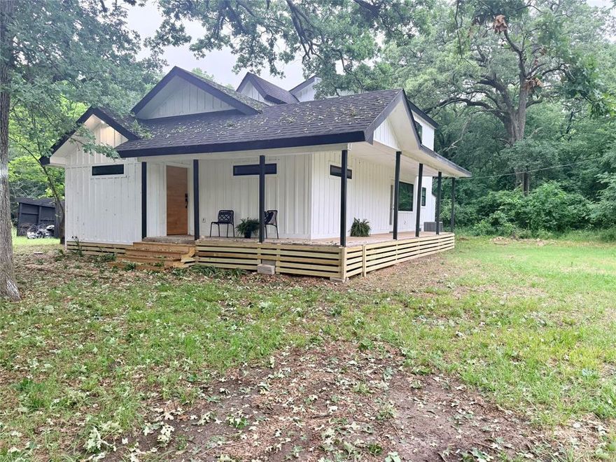 1.3 acre lake retreat just steps from Lake Tawakoni, fully renovated with new roof, HVAC, windows, plumbing, electrical and more. This open concept home features vaulted ceilings, a spacious kitchen with island, and large picture windows overlooking huge oak trees, wooded acreage, and wildlife. Enjoy huge decks perfect for relaxing and entertaining. Flexible layout with 4 full bedrooms, office space and a spa like primary suite. Ideal for a vacation rental, primary home, or investment. No zoning restrictions offer endless potential for future tiny homes or adding one or two more homes for income opportunities. This beautiful property is located in excellent Rains ISD and is a must see.