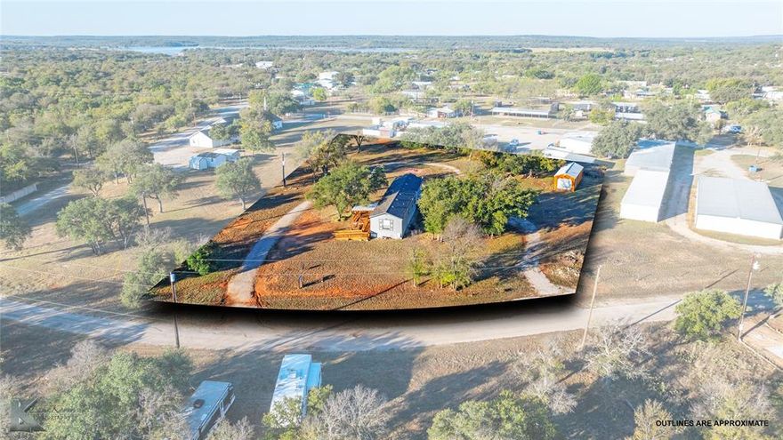 This charming 2019  mobile home offers 2 bedrooms and 2 bathrooms, thoughtfully designed for comfort and accessibility. Situated on a spacious .95-acre lot, the property features a handicap-accessible ramp and a covered porch, perfect for enjoying the peaceful surroundings. Mature trees provide shade and character, while three RV spots with hookups add versatility for guests. Wildlife lovers will appreciate the deer that roam the area like pets, creating a serene, nature-filled atmosphere. Conveniently located just a short drive from a boat ramp, this home combines modern living with outdoor recreation, making it an ideal retreat or investment opportunity.