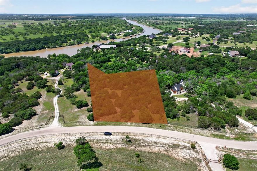 Discover an extraordinary 3.18-acre homesite in the prestigious, gated community of Silverado on the Brazos—a sanctuary of refined country living where luxury meets the timeless beauty of Texas ranchland. Nestled amid rolling hills and pristine natural landscapes, this coveted enclave offers an unparalleled blend of privacy, elegance, and tranquility. Perfectly positioned just minutes from Weatherford and Granbury, this estate-worthy lot provides the ideal canvas to create your dream residence—whether it’s a grand custom home, a state-of-the-art equestrian facility, a private sports court, or an opulent poolside retreat. Here, breathtaking sunrises and mesmerizing sunsets paint the sky, offering a daily masterpiece of serene countryside beauty. As a resident of Silverado on the Brazos, you’ll enjoy exclusive private access to the Brazos River, perfect for boating, fishing, and leisurely escapes into nature. Adding to the prestige of this exceptional location, the community is also home to Taylor Sheridan’s world-renowned Bosque Ranch, a landmark of Western heritage and elite equestrian culture. This is more than just a homesite—it’s an invitation to experience a lifestyle of sophistication, serenity, and exclusivity. Seize this rare opportunity to craft your own private estate in one of Texas’ most sought-after luxury communities.