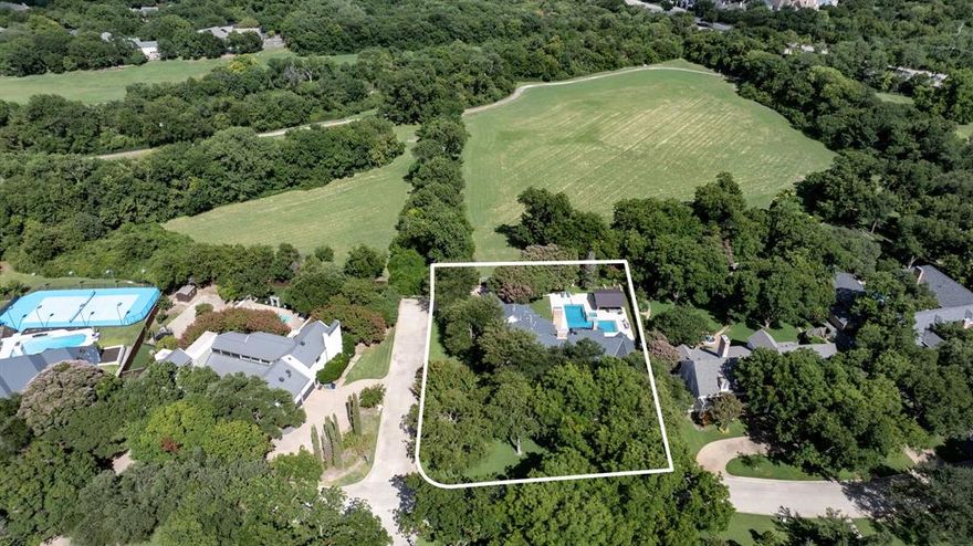 One of a kind remodel opportunity in one of Dallas' most extraordinary locations. This lot measures approximately three-quarters of an acre and backs to almost 60 acres of dedicated park land, offering gorgeous views of nature with tremendous privacy. The property itself features over 6500 square feet with large rooms, tall ceilings and numerous windows that anchor on beautiful views and bathe the home in natural light. The floor plan enjoys both formal and casual spaces that flow seamlessly from room to room, indoors to out. The primary suite is situated on the first floor with a gas fireplace, built ins, large bathroom and two spacious walk in closets and a private garden patio. A second guest bedroom with en-suite bath and large home office with a gas fireplace and built-ins round out the first floor. Three additional guest suites, each with private bathrooms and walk in closets, are located upstairs along with a secondary living room and game room. Please note that the property is being offered as a remodel opportunity giving buyers a chance to customize their finish out and fully remodel the home. The home is not move-in ready in it's current state and there are no interior photos available. Inquire with the listing agent directly for more information.