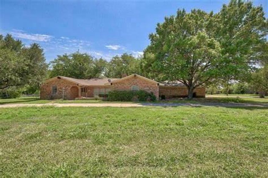 House on 1.04 acres with circle drive and parking on west side.