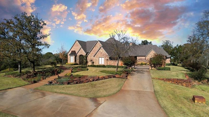 Welcome to 811 Russell Lane, your private escape nestled on 26+ acres of picturesque pastureland. This striking massive custom-built home offers the perfect blend of comfort and luxury. Perfect for both entertaining and peaceful living, this home is an architectural masterpiece, showcasing its custom design, high-end features, and impressive wood craftsmanship throughout. As you enter the home, the grand entry hall welcomes you with its 22-ft ceilings, bright natural light, formal parlor, dining room, and library-study with intricate oriental wood panels and shutters. The heart of the home is the great room with open concept kitchen and living area anchored by the oversized stone fireplace. The gourmet chef’s kitchen features top-of-the-line appliances, including a commercial-grade gas range & vent hood, built-in refrigerator, cooling and warming drawers, and an oversized island perfect for large gatherings. The private guest wing includes a cozy home theater with 108 in. screen, and three large bedrooms with full ensuite J&J bathrooms and large walk-in closets in each. Opposite the great room is the primary suite wing, which boasts a marble fireplace, Rocco marble Roman-style bathtub and glass brick walk-in shower with mist sprayers. The primary bath also features separate his & her vanities, water closets, and walk-in closets, one of which doubles as a safe room. Primary wing also features a cozy home office and bright & tranquil sunroom with custom cedar paneling and wet bar. A private mirrored exercise room takes up the entire second floor of the home and is complimented by an adjacent full bathroom with steam shower. Step outside into the resort-style backyard, where the stunning infinity pool appears to blend seamlessly with the horizon. The custom outdoor cabana features a built-in grill and fireplace, providing the perfect space for alfresco dining and relaxation. This estate exceed all expectations. Additional 70+ acres available.