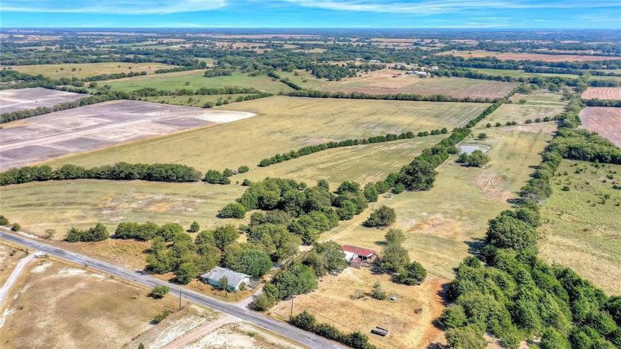 Wonderful 68.3 acres with quick access to Van Alstyne and US Hwy 75. Located in the sought-after VAISD. Rolling land with beautiful trees, a nice pond, native grasses, and a fully fenced perimeter. The adjacent acreage to the north is currently being developed. Excellent location—20 minutes to McKinney and 45 minutes to the intersection of US-75 and I-635.

See documents for the topo map, flood map, soil map, and property boundary map. Located outside city limits. Water is provided by South Grayson Water Co-op; electric is through Grayson-Collin Electric Co-op. AG exemption is in place.

The master plan for 1-acre lots has received final approval from the city, making this property ready to begin your new development project.

DO NOT TRESPASS. Contact listing agent for access.