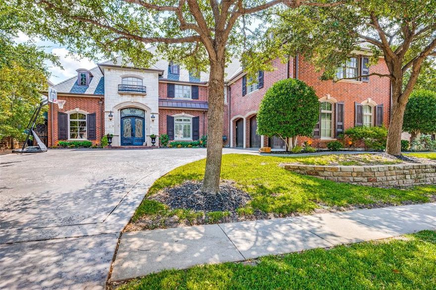 BACK ON MARKET AT NO FAULT OF HOME!  This exceptional custom home exemplifies classic design and architecture within the distinguished gated community of The Gates of Prestonwood, bordering Carrollton and Far West Plano, just minutes from the Tollway. The home showcases refined features such as elegant hardwood floors, a striking entryway, and a grand staircase. The study, kitchen, and dining areas seamlessly extend to a spacious covered outdoor entertainment area, which includes a custom pool, synthetic turf, a built-in grill, 2 fireplaces, and a guest quarters. On the second level, you'll find a versatile room for crafts, exercise, or gaming, 3 secondary bedrooms, 2 full baths, and a custom bar. The luxurious master suite, located on the ground floor, offers a generous bath, dual walk-in closets with built-ins, a comfortable seating area, and a large shower. The property also features a three-car garage, and a front drive situated on a quiet cul-de-sac.