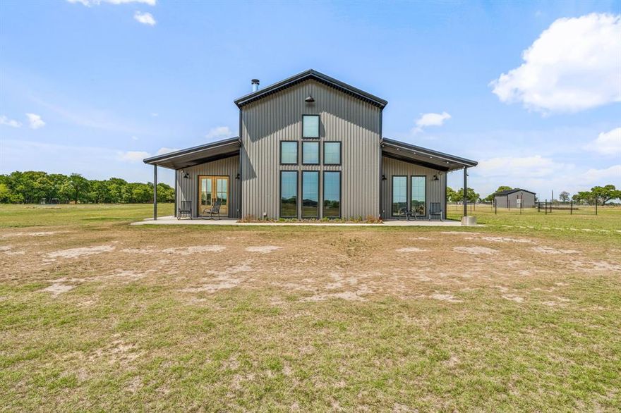 Welcome to your dream country retreat in Lipan, Texas—zoned for the highly sought-after Brock ISD. This beautiful 2,100 sq. ft, 3 bedroom, 2.5 bath barndominium sits on 11.5 acres of serene land, complete with a ¾-acre pond freshly stocked with bluegill and bass for endless fishing fun.
Step inside to a 25-foot vaulted living room ceiling with custom stained concrete floors and an open-concept design perfect for entertaining. Kitchen features an oversized walk-in pantry, large island, double fridge-freezers and ample cabinetry space. The luxurious master suite features French doors opening to a private patio, spacious walk in closet, and a large walk-in shower for a spa-like experience. Enjoy mornings or evenings on the patio overlooking a three-quarter acre pond freshly stocked with bluegill and bass.
Other highlighted features include a whole-home water filtration system, 2-inch Spray foam insulation, Pipe-gated entrance and cattle fencing for privacy and security, a 300 sf well house with  3,000-gallon storage tank, a tractor shed with a 40-foot container for storage and more!  
Perfectly located just 2 miles from Sugar Tree Golf Club, minutes from all Brock ISD campuses, and about 10 miles to I-20 for easy commuting—this property blends small-town charm with modern convenience. Whether you’re looking for a peaceful homestead, a hobby farm, or the perfect place to raise a family in a top-rated school district, this barndominium delivers it all.