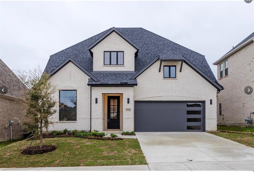 Experience a masterclass in contemporary design with this stunning white-brick custom residence perfectly positioned in North McKinney. From the moment the custom iron entry door swings open, you’re greeted by sprawling, upgraded light wood flooring and an airy upfront study accented by glass French doors and rustic wood beams. The aesthetic is modern and sophisticated, featuring a sleek horizontal stair railing that leads your eye toward a true chef’s sanctuary—a kitchen with stunning quartz countertops and a high-contrast black, white, and gold color palette. In the heart of the home, the family room’s soaring ceilings frame a breathtaking Modern Flames electric fireplace encased in premium quartz. Practicality meets luxury with two of the four bedrooms located on the main level, including a jaw-dropping primary suite boasting a designer-tiled bath and a deep standalone soaking tub. Head upstairs to find a massive, breathable game room and a dedicated media suite featuring custom contemporary lighting. Outdoor living is just as intentional, with a sprawling covered patio equipped with a gas stub, ready for your dream summer kitchen. With 4 spacious bedrooms, 3.5 baths, and access to a premier community pool just minutes from the boutique shops and vibrant dining of Downtown McKinney, this home isn’t just a place to live—it’s a lifestyle upgrade ready for its next chapter. Please see private remarks on how to set up a showing.
