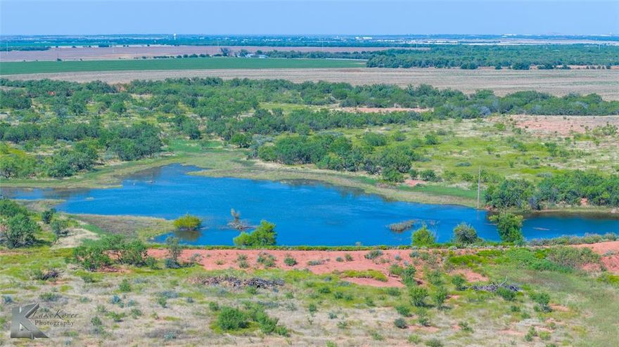 This 80 acre ranch is one of the most stunning and desirable homesite and recreational properties in the Big Country. Just five minutes outside Abilene city limits, you’ll feel like you’re worlds away while still being close to everything. From the hilltop you can take in incredible views of the neighboring Buffalo Gap mountains while looking out over your own land. The property features a 3 acre stocked tank perfect for fishing, rolling elevation changes, and a mix of open pastures and natural cover. Wildlife is abundant, making it an outdoorsman’s dream. You’ll also appreciate the paved road frontage, available utilities, and the fact that minerals convey. Currently Ag exempt and previously used for cattle grazing, this property is versatile and ready for whatever you have in mind. Whether you’re looking to build your dream home, start a homestead operation, or just enjoy the views and wide open spaces, this place has it all. Agent is related to sellers. Deer blinds and feeders stay.