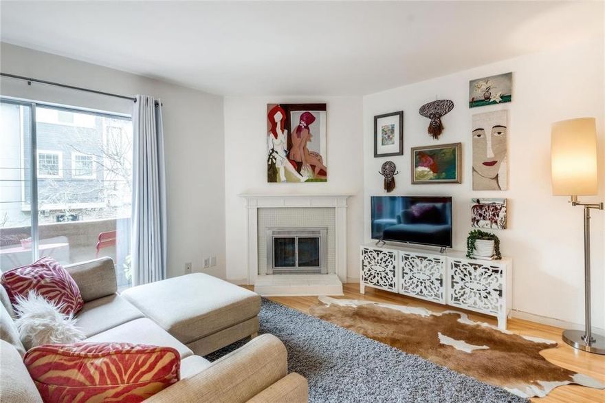 Light-filled and thoughtfully designed, this charming one-bedroom condo offers a modern, airy feel with bamboo floors, white quartz countertops, and a private terrace. New air conditioner installed in 2024. The efficient layout features a functional kitchen, built-in banquette with storage, half bath, and wood-burning fireplace on the main level, with a spacious upstairs bedroom, office nook, second fireplace, walk-in closet, laundry closet, and full bath with vintage vanity and walk-in shower. Meticulously maintained and part of a pet-friendly community with guest parking, private pool, on-site storage, and recent roof and boiler updates, the home is ideally located on tree-lined Buena Vista Street just steps from the Katy Trail, Cole Park, West Village, and Knox-Henderson, offering easy access to Uptown’s best shopping, dining, and wellness spots.