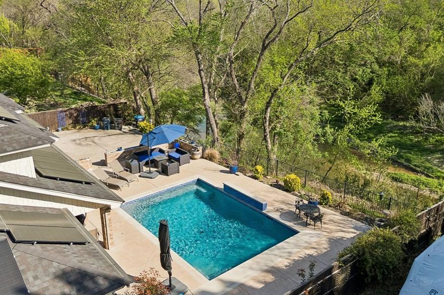 Located in the desirable Ridglea Country Club Estates, this sophisticated 4 bedroom 3 bath home blends timeless style with thoughtful modern updates. An inviting open layout showcases wood flooring throughout the main living areas, creating a warm and elegant atmosphere ideal for both everyday living and entertaining. The spacious living room features a fireplace with electric logs that could be easily converted back to wood burning, and a stunning built in bar complete with floating shelves, an ice maker and wine refrigerator, offering the perfect setting for gatherings! The kitchen offers both elegance and function, with beautiful cabinetry, granite countertops, breakfast bar with decorative lighting, stainless appliances and an induction cooktop! The serene downstairs primary suite serves as a private retreat, featuring a fireplace, built ins, and direct access from french doors to the covered patio and sparkling pool. The spa inspired primary bathroom includes dual sinks, beautiful freestanding  soaking bathtub and a custom designed walk in closet! Step outside to a beautifully designed backyard oasis featuring a wonderful covered patio, multiple gathering areas, and a gorgeous pool, perfect for entertaining, relaxing, and enjoying outdoor living year round. Additional features include a convenient mudroom as you walk in from garage, large laundry room with room for second refrigerator, tankless water heaters, plantation shutters throughout home, argon 5 pane windows and so much more. This exceptional property offers comfort, sophistication, and resort style amenities in one of Fort Worth's most sought after neighborhoods on Trinity River.