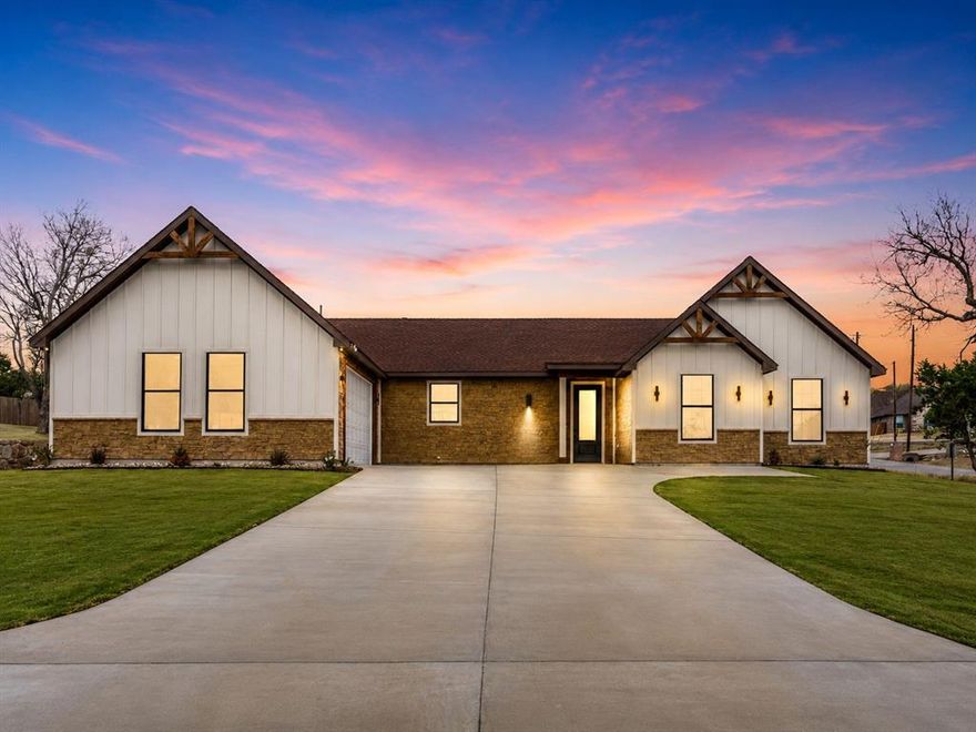 Escape the city without sacrificing comfort in this brand-new, move-in ready home located in the gated lake community of Indian Harbor in Granbury. Designed with modern living in mind, this 4-bedroom, 2-bath home offers an open-concept layout with a spacious living area, soaring natural light, and a sleek electric fireplace that creates the perfect space to relax or entertain.
The kitchen is built for both everyday living and hosting, featuring white quartz countertops, stainless steel appliances, a large pantry, and an oversized sink overlooking the main living and dining areas—keeping everyone connected.
The private primary suite offers a peaceful retreat with a spa-inspired bathroom, garden tub, separate shower, dual vanity, and a large walk-in closet. Three additional bedrooms provide flexibility for family, guests, or a home office.
Step outside and enjoy the large backyard, covered patio, and the slower pace of lake-community living. Additional upgrades include spray foam insulation for improved energy efficiency and a built-in sprinkler system for added convenience.
Indian Harbor residents enjoy gated security, community pool, clubhouse, playground, fishing pier, and lake access with boat ramps—perfect for weekend boating, fishing, and outdoor living.
If you’ve been searching for a new construction home with modern finishes, energy efficiency, and access to lake amenities, this home stands out from the competition.