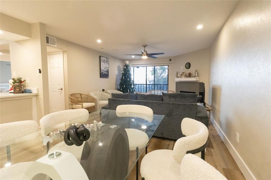 Renovated and move-in ready condo in a convenient Dallas location with quick access to I-635 and US-75. This light-filled unit features wide-plank wood-look flooring, recessed lighting, and an open living and dining layout with a cozy fireplace. The updated kitchen offers quartz-style countertops, shaker-style cabinetry, stainless steel appliances, and a breakfast bar overlooking the main living area. Enjoy a spacious screened balcony with ceiling fan and storage closet, perfect for relaxing. Located near shopping, dining, and major highways for an easy commute.