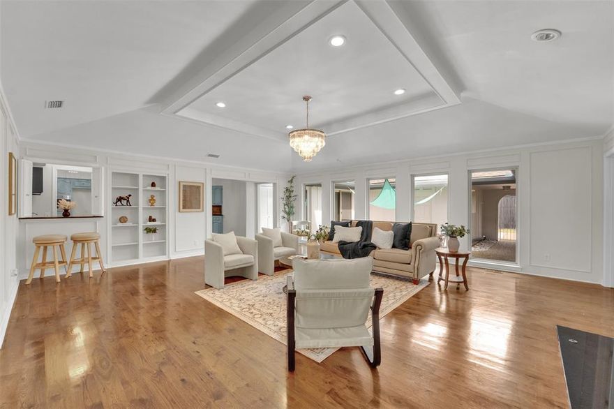 Welcome to 9511 Robin Meadow Dr, where everyday comfort meets an unbeatable Lake Highlands lifestyle just moments from the highly desirable Town Creek neighborhood. This inviting home stands out with its spacious, light-filled layout, soaring vaulted ceilings, elegant trim work, and custom built-ins that bring warmth and character to every room. The kitchen is both stylish and practical, featuring granite countertops, abundant cabinetry, and a seamless flow into the breakfast nook and main living area—anchored by a cozy fireplace that makes the space perfect for gathering and entertaining. Versatile living areas offer endless possibilities, whether you need a home office, fitness room, playroom, or additional lounge space. The generously sized primary suite provides a peaceful retreat with its own private bath, creating the perfect place to unwind. Thoughtfully maintained, the home includes major updates such as a 2012 roof, 2013 AC unit (with a second unit in good working condition), a 2014 water heater, and newer windows installed in recent years, along with a solid foundation. Step outside to a private backyard oasis ideal for relaxing evenings, weekend gatherings, or gardening. Ideally located near scenic trails, parks, major highways, including Hwy 75 and I-635, and zoned to highly regarded Richardson ISD schools, this home offers the perfect balance of comfort, flexibility, and prime North Dallas convenience.