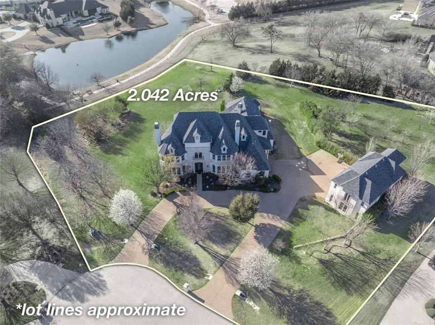 Where contemporary sleekness meets masterful design & versatile functionality this stellar showstopping estate presents as though it was lifted from the pages of a modern design magazine. Showcasing 5 beds, 5.5 baths, 4 living areas, 2 storm shelters, 3 fireplaces, a study with a 2nd story library, 2 attached garage spaces and a separate 4-car garage that features a floored walk in 1500 square foot space with electrical, water & gas that can make a future apartment. Enter & find architectural flair & impressive craftsmanship with Brazilian cherrywood floors thru much of main level & ornate molding sprinkled thru. The island kitchen is a chef’s dream with SS Dacor appliances, 6-burner cooktop with pot filler, dbl ovens, warmer drawer & built-in sub 0 fridge-freezer. Grand study with 2 sets of dbl glass panel doors & wall of windows with view of sprawling 2.042 acre estate with apple, peach & walnut tree orchard all backing to a pond. See extensive amenity list attached.