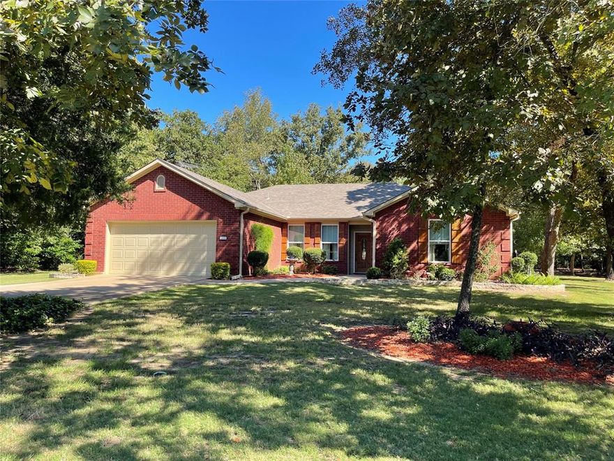 This charming brick home boasts 4 bedrooms & 2 baths, offering ample space for your family’s needs. With 1,988 sf, this well-maintained home was built in 1999 & has been recently updated with a new roof, HVAC system, & windows. The interior has a comfortable & inviting atmosphere, thanks to the open floor plan & thoughtful layout. The bedrooms are conveniently split, ensuring privacy & tranquility. Plus, the home offers plenty of storage space with its large closets. Step out onto the covered back porch & take in the peaceful surroundings. The meticulously landscaped 1-acre lot is equipped with a sprinkler system. For the handy individuals, a well-appointed workshop awaits, allowing you to pursue any DIY projects with ease. There is additional storage for your convenience that will accommodate your boat & lawnmower perfectly. The concrete driveway adds convenience & functionality to your everyday life. Don’t miss the opportunity to make this wonderful property your own.