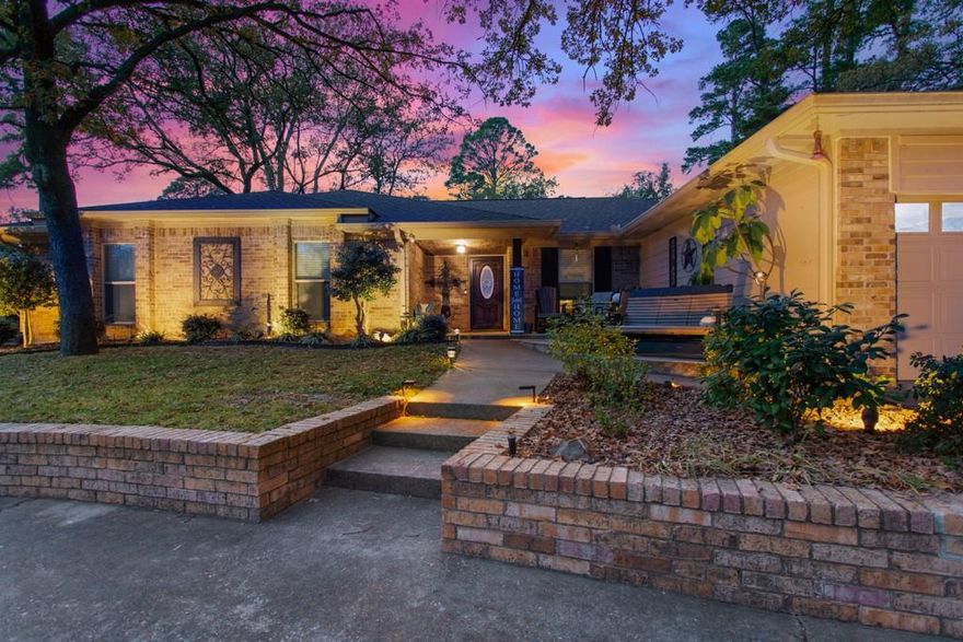 Get ready to love where you live! Hideaway, Texas is a 24-hour gated, Security Guarded, city with a resort community atmosphere offering Golf, Tennis, Pickle Ball, Community Pool, Parks, Dog Park, RV area for visiting company, recycling, three lakes, trails, over-the-top 4th of July Fireworks and more. Every bit of that fun comes with this amazing 4-3-2 home with two office spaces and multiple up-dates! The beautifully landscaped front yard has a circular driveway and three cascading patios. The backyard sports a huge, covered entertainment area and a water spigot right next to the fenced garden. Enjoy a quiet time in the reading nook of your primary bedroom! The en suite bathroom has a walk-in closet, a shower updated in 2022, spa tub, double sinks and a beautiful make-up area. The primary suite is split from the remaining 3 bedrooms, one of which also has an en suite bathroom. The third full bath is between the other two bedrooms. A spacious office, which can easily be converted into a fifth bedroom with a closet, is next to the entry hall. Gather in the bright living area where light streams in through the oversized skylight and the wonderful woodburning fireplace can even be enjoyed from the adjoining dining area. The galley kitchen has a great deal of cabinets plus, a new dishwasher, and double ovens were installed in 2022. The double door pantry is a blessing, as is the mud room just inside the door from the garage. A second office space is in the laundry room and the last room to note is the delightful, screened in Sunroom with stairs leading to the upper entertainment area where you can enjoy the sound of rain on the metal roof. The shingled roof on the house is 2 years old. Schedule your showing today — and come see how this home and its community offer the perfect balance of everyday luxury and active resort-style living.