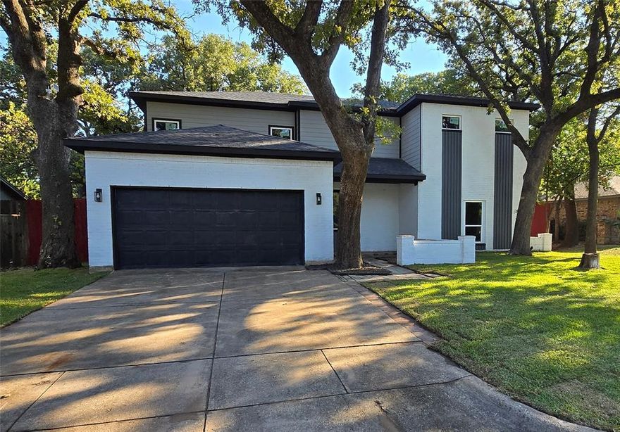 Presenting an incredible value with the lowest price per square foot in a 3-mile radius, $133 per sqft vs $166 -$177 average in Arlington. This stunning 3,464 sqft home has been masterfully rebuilt from the slab up, effectively brand new, blending modern luxury with the charm of a peaceful, established neighborhood. The open floor plan features 5 bedrooms, 4 full baths, and two living areas, offering exceptional flexibility with dual master suites—one on each floor—and a private first-floor in-law suite. This is an ideal home for multigenerational families. Soaring 10-foot ceilings on the main level and 9-foot ceilings upstairs create a grand, open atmosphere. Massive open living area upstairs. The sleek and stylish gourmet kitchen serves as the heart of the home, boasting premium stainless-steel appliances, quartz countertops, and a striking waterfall island. Every detail has been meticulously constructed, including all-new electrical, plumbing, Dual HVAC systems, roof, windows, and designer fixtures. From the luxury flooring and modern fireplace to the finished backyard deck, move-in ready. This is a rare opportunity to own a virtually new home in a prime location.