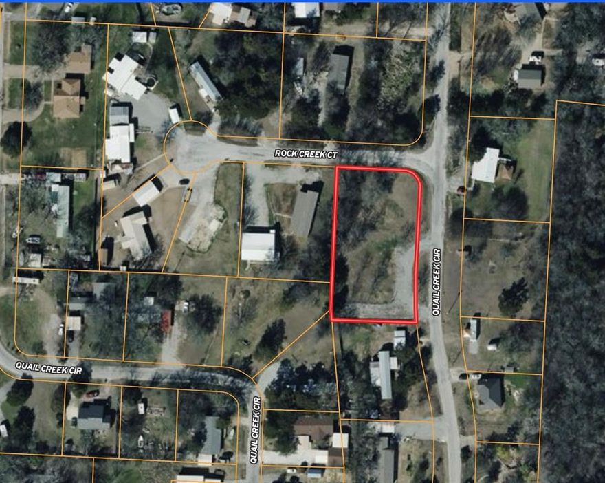 Welcome to 197 Quail Creek Circle—a versatile corner lot spanning 0.6 acres, ready for your next adventure. This property features existing infrastructure for two RV hookups, including water, electricity, and septic, plus a gravel pad and circle drive for easy access. Whether you’re looking to lease out sites or enjoy your own RV, this location offers flexibility and convenience. The neighborhood is situated just off Highport Drive, leading directly to Highport Marina on Lake Texoma, as well as Tanglewood Resort, restaurants, and other local amenities. Brookshires Grocery and Ace Hardware are nearby for your everyday needs. Manufactured homes are permitted in this area, making it one of the few locations near the lake with this option. The lot has a slope, but it is manageable and adaptable for various uses. Enjoy a welcoming community of both full-time residents and weekend visitors. Don’t miss this opportunity to create your ideal retreat or investment property!