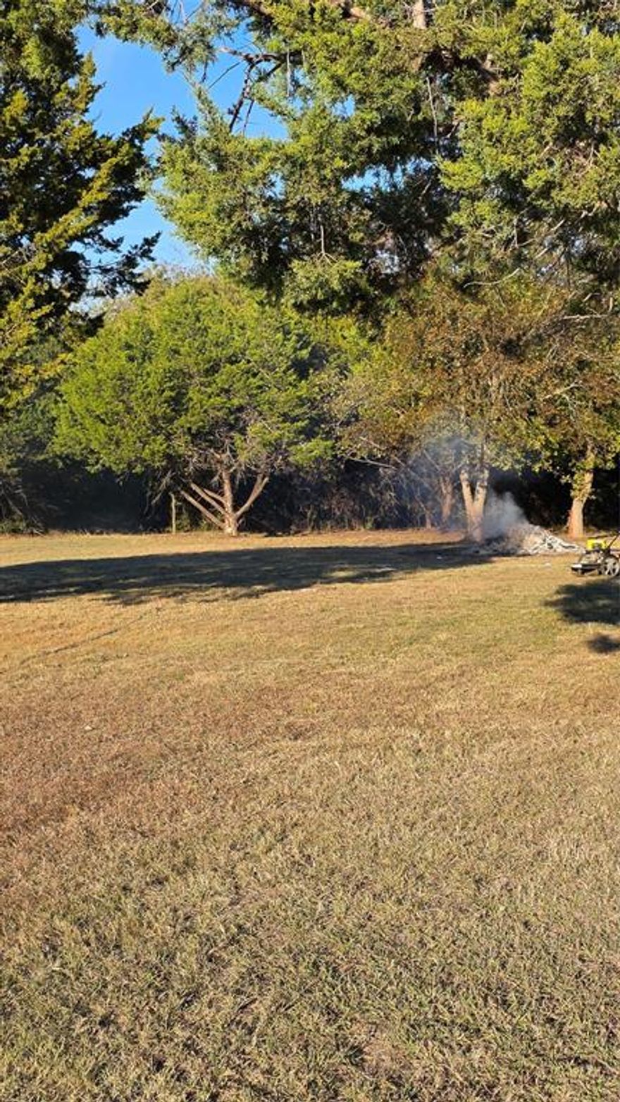 Discover this stunning .23 acre lot cleared  and ready to go, with just the perfect mix of open space and mature tress. The level terrain makes it ideal for building your dream home or placing a new mobile. The property is fully equipped with all utilities, including septic, an RV hookup, and a storage building for convenience. With No restrictions, you'll have the freedom to create  the perfect setup to fit your lifestyle. Located just outside of Whitney, TX, you'll enjoy peaceful country living close to Lake Whitney and all it has to offer.