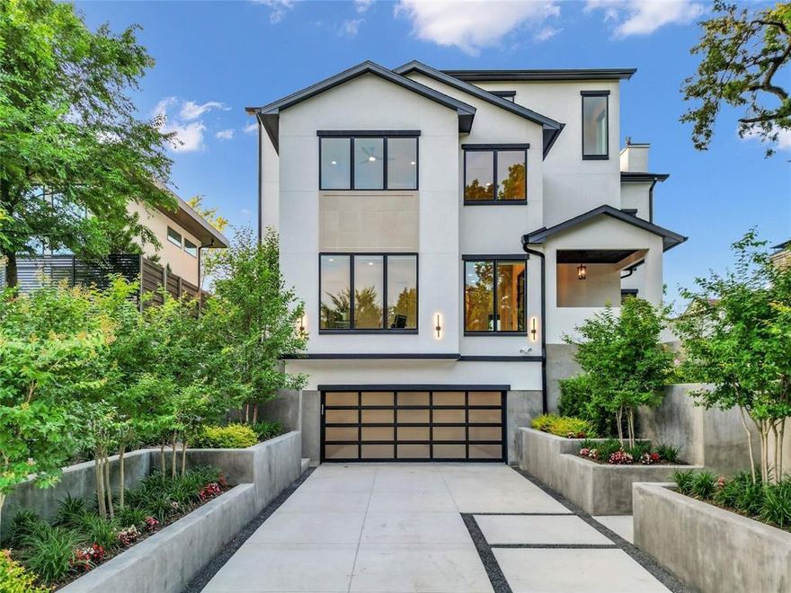 Elevated elegance in East Kessler. Nestled in the highly sought-after East Kessler community, this meticulously crafted new build by Kessler Hill Custom Homes delivers luxury, architectural precision, and serenity on one of the neighborhood’s most exclusive hillside streets. Built on an elevated lot with pier-and-beam construction, reinforced concrete retaining walls, and professionally designed landscaping, the home combines enduring strength with dramatic curb appeal. Inside, a soaring 20-foot-ceiling living room with white-oak floors and floor-to-ceiling windows sets a tone of light and sophistication. The gourmet kitchen features a massive quartzite island, commercial-grade range, and a custom butler’s pantry ideal for entertaining. An elevator connects all levels, including a second-floor lounge with two ensuite bedrooms and a terrace showcasing iconic Dallas views. The top floor offers a flexible multi-purpose suite with a built-in bar — perfect for media, game, or guest use. The primary suite on the main level is a private retreat overlooking the pool and treetops, complete with a sitting area, spa-inspired bath with dual vanities, soaking tub, and custom walk-in closet. The outdoor living space is a showpiece — a lush, elevated courtyard with resort-style pool and mature landscaping that create both intimacy and grandeur. Just a short walk from Kidd Springs Park and minutes from Bishop Arts and Trinity Groves, this home blends the tranquility of hillside living with the energy of urban Dallas.Move-in ready with builder home warranty.