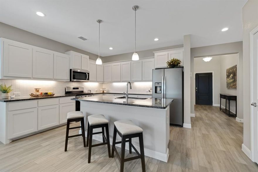 Welcome to your next chapter in the award-winning Pecan Square community of Northlake, TX—where modern convenience, small-town charm, and resort-style amenities come together seamlessly. This beautifully maintained 4-bed, 3-bath home shines with fresh updates, inviting spaces, and a prime location in one of North Texas’ most desirable master-planned neighborhoods.

Step inside to a bright, refreshed interior featuring **new paint and carpet (October 2025)** throughout. The open-concept layout offers flexible living options, while the stylish kitchen—complete with **a new dishwasher (August 2025)**, abundant cabinetry, and generous counter space—serves as the heart of the home for everyday meals and effortless entertaining.

Enjoy peace of mind with major updates already taken care of, including a **new roof and garage door (May 2025)**. The private backyard offers a relaxing retreat perfect for unwinding or hosting weekend gatherings.

Living in Pecan Square means access to unmatched amenities: **three sparkling pools**, Pickleball courts, a fitness center, co-working spaces, walking trails, event pavilions, basketball courts, and multiple community parks. Families will love the highly rated **Northwest ISD**, with a brand-new middle school opening in August 2026.

Commuting is a breeze with quick access to **I-35W, Highway 114, and FM 407**, placing shopping, dining, and major employment hubs just minutes away—while still enjoying the peaceful, welcoming atmosphere Pecan Square is known for.

Experience the perfect blend of comfort, community, and convenience—right here in Pecan Square. Welcome home.