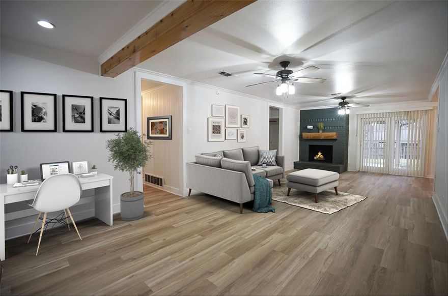 This home is ready for move in! Fresh paint throughout, new interior doors and new flooring! This open floor plan features a split bedroom arrangement with ceiling fans in every room! Living area has a wood burning fireplace, wood beams, and two ceiling fans. The kitchen has granite counter tops, newer cabinetry, and a new oven coming soon! The primary bedroom is quite large and has double sliding doors into the vanity area of the private bath.  There is a walk in closet, and a walk in shower. The two secondary bedrooms are very good sized with nice closet space. The backyard has a covered patio area with room to play! This home also features vinyl windows throughout most of the home. Fantastic mid cities location, close to DFW airport, and right between downtown Dallas and downtown Fort Worth.