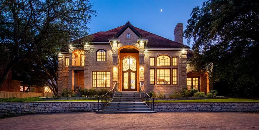 An exquisite palatial estate nestled in The Enclave at Windsor Ridge A private, gated entrance beckons you onto this luxurious 5 Bed+ office & 8.5 Bath custom residence filled w artisan features. Master suite has his&hers master baths, jetted tub w a built in TV, & its own washer & dryer closet. Elegant steel French doors, Italian marble flooring all throughout & a grandiose Vienna crystal chandelier set a warm & elegant mood for you & your guests as you walk from the foyer to the Living Room. Chef’s kitchen boasts state-of-the-art Viking appliances, dual sinks, dishwashers & ovens, Taj Mahal-imported Granite countertops & lots of custom-built storage spaces. The home is completely automated & smart controlled, 4 outdoor patios, 2 indoor Jacuzzis, & a wine cellar. Pool features swim up bar & outdoor kitchen. The pool bath features Travertine heated flooring & secret door to the Master Suite. See Full Features in supplements.