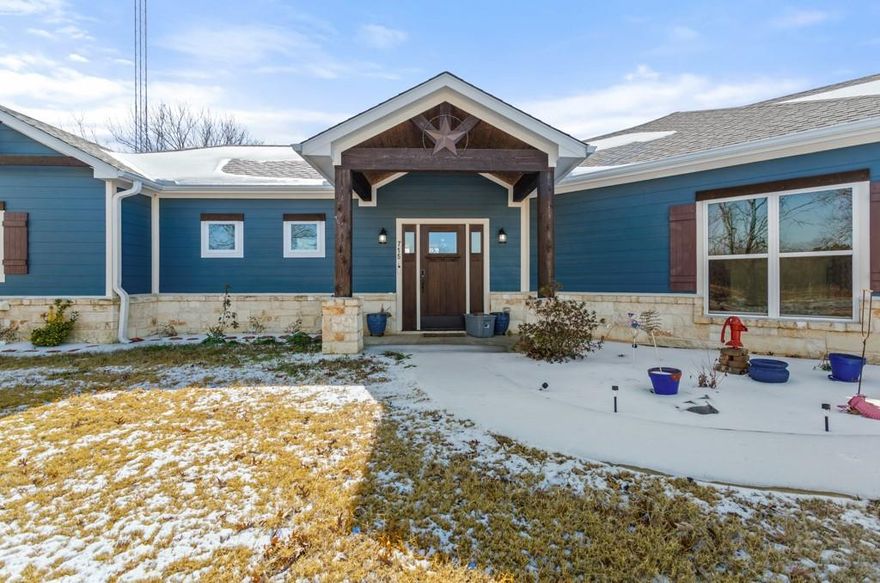 Built in 2022, this custom home sits on 2 beautiful acres and offers the space and comfort so many people are looking for right now. You are technically in the county, but still less than a minute from town, giving you the best of both worlds. Inside, you are greeted by soaring ceilings, exposed beams, and beautiful windows that bring in an abundance of natural light. The perfect corner wood burning stove makes this space so cozy! The kitchen is truly stunning and the heart of this home. Custom cabinetry throughout, a mixer lift cabinet, coffee bar, and plenty of counter space make it both beautiful and practical for everyday life. All three bedrooms are oversized, giving everyone room to spread out. The primary bedroom has a beautiful en suite, and every part of the home shows the care that went into how it was designed and built. Outside, the two acres give you room to enjoy the outdoors whether that means a shop, a garden, entertaining, or simply having space around you. The screened in back porch is a great place to slow down and enjoy the peaceful setting. It is rare to find a newer home with this level of space, detail, and land, all so close to everything. This one checks boxes you do not usually get to check.