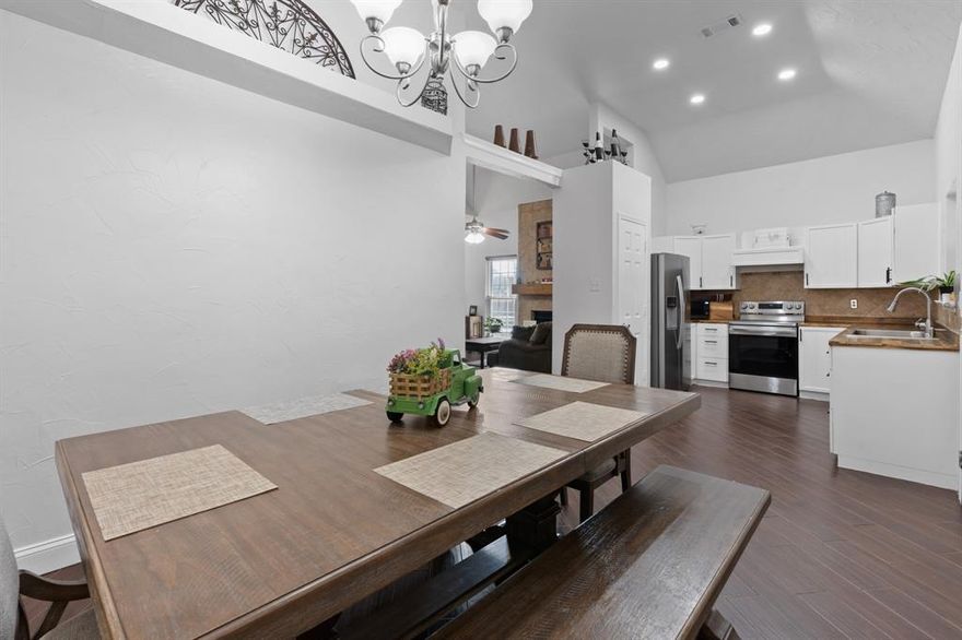 Welcome to your perfect starter home, ideally located between Dallas and Arlington with easy access to HWY 12. This charming residence offers an inviting open-concept layout with vaulted ceilings, flooding the space with natural light. The kitchen boasts stainless steel appliances and a stylish butcher block countertop. Recent updates include fresh interior paint, updated bathrooms, an added bedroom, and modern flooring. With neutral tones, decorative lighting, and ceiling fans throughout, this home is move-in ready. Just minutes from shopping, dining, parks, schools, churches, and medical facilities, it's the ideal combination of comfort and convenience.