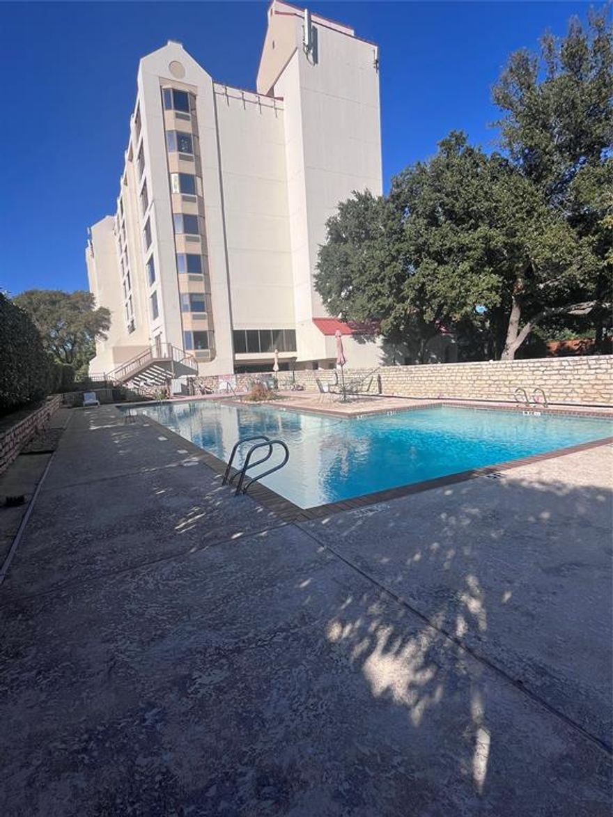 Rare gem located by Lake Arlington with great views of the lake from the 5th floor; this 34 unit complex is one of a kind in a high rise building overlooking the lake and its boating, fishing, and picnic amenities; the unit is a 2 bedroom 2 bath spacious condo with an open floorplan; updating is needed to bring this gem back to its lovely state; a separate utility room provides convenience and the spacious kitchen features plenty of counter and cabinet space for the culinary experience of its occupants; Perfect for those downsizing, a young professional, or simply someone who enjoys lake living without the fuss.  The master suite includes an ensuite complete with separate bathtub and shower accommodations.  Bring your renovation and decor ideas to this well situated condo.  Large window in the living area is being replaced by current owner. HOA includes utilities of water, sewer, trash and electricity, full use of facilities including a small work out area, a clubhouse, and a community swimming pool; one parking space in covered garage and one storage unit located in garage area; one monthly payment takes care of utilities.  Carefree living at its best.