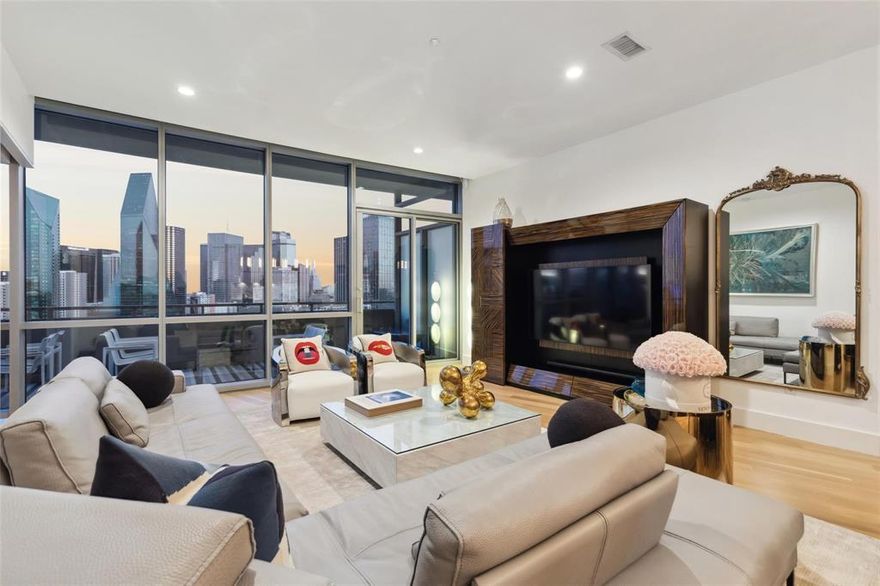 Perched on the 20th floor of the iconic Philippe Starck-designed high-rise in Victory Park, this stunning residence boasts floor-to-ceiling windows framing sweeping, unobstructed views of the Downtown Dallas skyline.

The sleek European-style kitchen is appointed with statuary white marble countertops and backsplash, along with premium Sub-Zero, Wolf, and Asko appliances. The spa-inspired bathroom features a custom double vanity, oversized soaking tub, expansive shower, and finishes in elegant white marble.

Throughout the home, wide-plank white oak floors, museum-finish walls, and curated contemporary lighting create a refined and modern ambiance. Step outside to a spacious 259-square-foot private balcony - perfect for morning coffee or evening views.

Additional features include one reserved parking space with EV charging outlet.

Residents enjoy a world-class amenity package: a dramatic 130-foot infinity-edge pool on the terrace, owner’s lounge, guest suite, state-of-the-art fitness center, outdoor kitchen, and more. White-glove services include concierge, valet, 24-hour security, and package delivery.

Live elevated in one of Dallas’ most prestigious addresses.