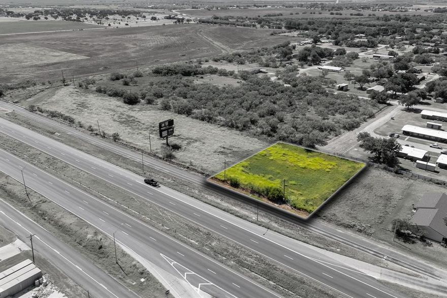 Looking to expand your portfolio with an investment property? This land is zoned for commercial, has easy access to a two way I-20 frontage road with high visibility. Perfect for RV park, storage buildings, office buildings or residential duplexes.  Lot is already level and nearly clear of trees, which simplifies construction logistics, reducing groundwork complexities and associated costs.. There is utilities running adjacent to the lot that includes water, electricity and high speed internet. With Merkel growing and Abilene expanding westward, now is the time to invest as land is the top real estate investment. Lot is 1 acre but there is also 2.18 acre lot next to it that can be added for a total of 3.18 acres. Not in a known flood zone, buyer to verify.