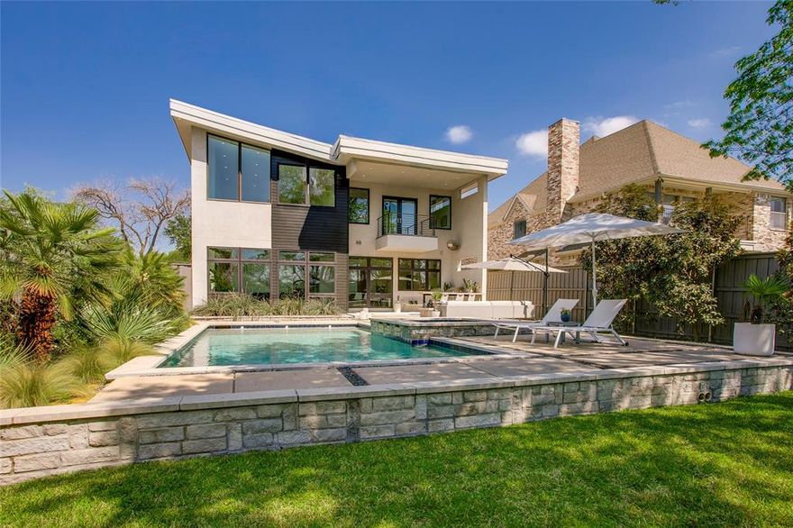 Custom-built and masterfully designed, this modern gem is nestled in the coveted Henderson corridor, blending sleek aesthetics with unmatched quality. From the moment you step inside, you'll be captivated by the museum-smooth walls, soaring ceilings, and walls of Anderson windows that bathe every corner in natural light.

The thoughtful layout welcomes you with a spacious entry, wide gallery-style hallways, and an open-concept living space that flows seamlessly into large, comfortable bedrooms. The kitchen is a chef’s dream, boasting a Wolf-Sub Zero appliance package, an abundance of custom cabinetry, a large center island, and expansive quartz counters, perfect for everything from gourmet meals to casual gatherings. The bedrooms are split in layout with the primary featuring a balcony overlooking the city skyline and rear yard.  All of the bathrooms are adorned with sleek, modern fixtures and luxurious finishes. 

But it’s the backyard that truly elevates this home to a serene retreat. Step outside into your own personal sanctuary, complete with a sparkling pool, relaxing spa, cozy fire pit, outdoor kitchen perfect for al fresco dining, and a lush, expansive grassy area. Whether you're hosting friends or enjoying quiet evenings under the stars, this outdoor space is designed for both relaxation and entertaining.

And the location? Highly walkable, with an abundance of dining, shopping, and entertainment options just steps away. If you’ve been searching for a spacious, modern home with a backyard oasis in the heart of one of the city’s hottest neighborhoods, look no further!