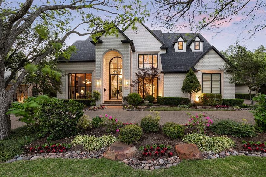 On one of the prettiest blocks in Preston Hollow, surrounded by manicured landscaping, this beautifully updated home is in pristine condition.  The steel-framed front door, sweeping staircase, handsome office, & two-story windows make a grand first impression, while the family room off of the remodeled kitchen is the perfect setting for everyday living. 2 dining & 2 living areas are ideal for entertaining. The downstairs master bedroom is a serene retreat with a dual-sided fireplace into the updated master bath with 2 walk-in closets. 1st floor also includes a guest suite, a bar area, an oversized utility room off the kitchen, & a 3-car garage with A+ storage. Upstairs are 2 more guest bedrooms, large game room, & exercise room. Outside, the heated pool, covered cabana, & phantom-screened porch make outdoor living enjoyable any time of year. 2017 Exterior Paint, Front Door & 2018 Roof, New Front Windows. This stunning property is pre-inspected, thoughtfully renovated, & move-in ready.