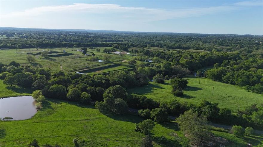 If you are looking for a small slice of heavenly peace and quiet and only minutes to town, take a look at these two tracts available, this is the one acre tract that has road frontage on the highly sought after Dripping Springs Road and available utilities include Starr water , and GCEC power.  Your dream home design awaits you on this awesome one acre tract, located between Sherman and Denison , 3 miles from Hwy 69 in Denison or 3 miles from Hwy 82 just east of Sherman.  Property is on the Denison ISD but route, super low area traffic and amazing sunrises and sunsets await you from your porch or deck, just minutes from town.  take a look at the filed plat in the transaction desk,  the 1 acre is on the far left at the road, no pond is being offered with this tract. 
No manufactured homes, no mobile homes, only site built homes allowed. New owner will be responsible for fence on one side to keep neighboring livestock from property. 
Denison and Bells school districts are a possibility according to owner of parent tract.