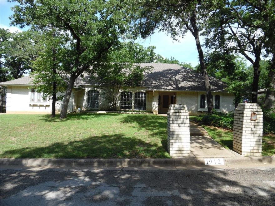 This spacious home sits in the beautiful and highly sought-after Cookes Meadow Addition. While it could use some updating, it offers plenty of room to make your own. It features a large living room with an adjacent second living area, a formal dining room, and a cozy breakfast nook. The kitchen has ample cabinet space, and there are washer and dryer hookups for convenience. A roomy two-car garage with a side entrance adds to the appeal. The large backyard, shaded by mature trees, is perfect for relaxing outdoors. The master bath includes his-and-hers walk-in closets and a separate shower. Located just minutes from I-30, with an easy drive to downtown Fort Worth or Dallas, it’s a great spot to create your dream home.