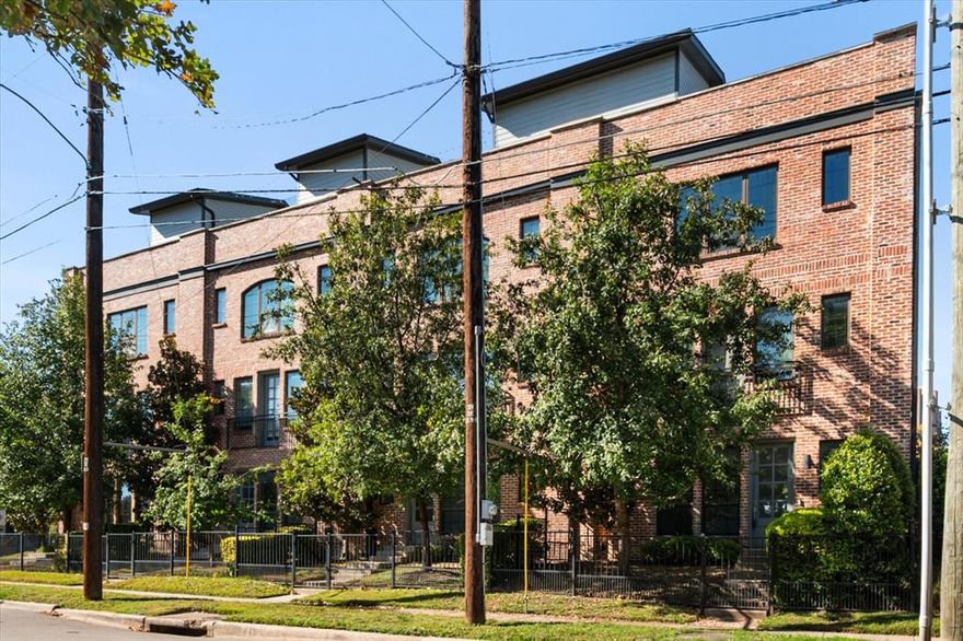Step into stylish city living in this beautifully designed three-story condo featuring 2 bedrooms and 2.5 baths, perfectly positioned in one of Dallas’ most sought-after urban enclaves. This desirable corner residence offers added privacy along with a fenced front courtyard—ideal for pets or a cozy outdoor retreat. Inside, an inviting open-concept living and kitchen area welcomes you with warm natural light, rich flooring, and a sleek fireplace that anchors the space. The kitchen is thoughtfully appointed with custom cabinetry, quartz surfaces, a charming butcher-block dining nook, and stainless-steel appliances, making everyday cooking both effortless and enjoyable. The second-floor living level is crafted for entertaining and day-to-day comfort, offering generous room to relax, dine, and gather. Upstairs, the primary suite provides a peaceful escape with a spacious layout and a private bath designed for relaxation. A secondary bedroom with its own en-suite bath creates the perfect guest suite or flexible home office option. Capping off this exceptional home is an expansive rooftop deck, offering the perfect backdrop for morning coffee, evening conversations, or hosting friends while taking in dramatic Dallas skyline views. For fitness enthusiasts and outdoor lovers, the Katy Trail is just 8 minutes away, providing a scenic route for running, walking, or cycling. With a 2-car attached garage, contemporary finishes throughout, and a walkable location near premier dining, shopping, and entertainment districts, this lock-and-leave condo delivers modern elegance, convenience, and the vibrant lifestyle you’ve been searching for.