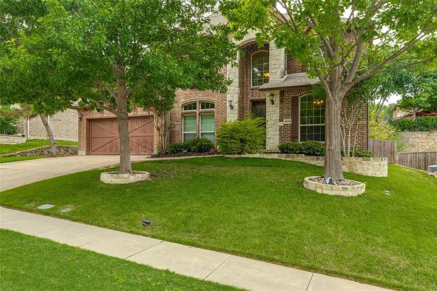 Welcome to this beautifully updated home in the highly sought-after Flagstone community, offering standout curb appeal and meticulously maintained landscaping. Designed for both everyday comfort and effortless entertaining, the open-concept floor plan is filled with natural light. The living room is a true focal point, featuring soaring  ceilings, rich hardwood floors, and a striking stone fireplace.The chef’s kitchen is equally impressive with a large island and breakfast bar, white cabinetry, granite countertops, stainless steel appliances, a 5-burner cooktop, double ovens, a butler’s pantry, and a walk-in pantry. The adjacent breakfast area includes a charming window seat with peaceful views of the backyard. 
A dedicated first-floor office with French doors and wainscoting provides an ideal work-from-home setup. The secluded primary suite offers a relaxing sitting area and a well-appointed ensuite bath with dual vanities, granite countertops, a jetted tub, separate shower with bench seating, and a spacious walk-in closet.  A secondary bedroom and full bath on the main level offer flexibility for guests or multi-generational living. Upstairs, you’ll find two additional bedrooms connected by a Jack-and-Jill bath, along with a game room, media room, and a floored walk-in attic providing excellent storage. Located within highly regarded McKinney ISD and just minutes from shopping, dining, and major commuter routes. Recent updates include two water heaters (2025) and a garbage disposal (2026).  Picss  posted this afternoon