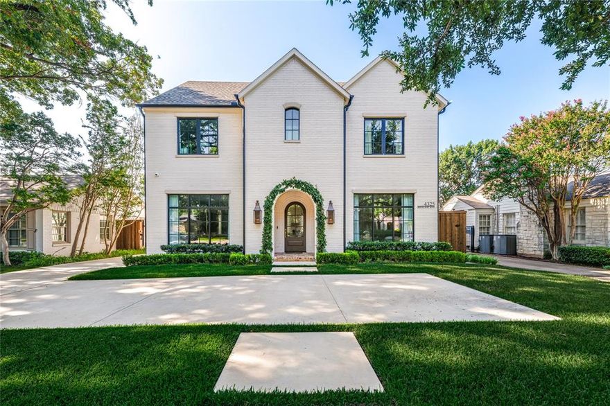 Completed in 2023 by Canterbury Homes, this beautifully crafted residence combines timeless architecture with easy function in one of Dallas’s most walkable and family-friendly neighborhoods. Zoned to acclaimed Hyer Elementary in Highland Park ISD—recently ranked the #1 5A & 6A school district in Texas—this home offers both an A+ location and the convenience of newer construction. A light-filled entry welcomes you into the open and thoughtful floor plan. Just off the foyer is a private office or formal living room with access to a powder bath. The elegant dining room connects seamlessly to a butler’s pantry and walk-in pantry, creating the perfect flow for entertaining. At the heart of the home, the bright white kitchen features custom cabinetry, premium appliances, commercial Wolf range with two ovens & gas cooktop, and an oversized island, opening to the breakfast area and casual living room with fireplace and built-ins. Expanded sliding doors extend the living space outdoors to a covered patio with its own fireplace, designed for year-round indoor-outdoor living. Upstairs, four spacious en-suite bedrooms include the vaulted primary suite with a spa-like bath, dual vanities, soaking tub, and large walk-in closet. One secondary suite currently functions as a game room, offering flexible use. A fifth en-suite bedroom occupies the third floor, providing privacy for guests or older children. Features include beautiful white oak wood flooring, tall ceilings and an elevator closet! The detached two-car garage includes a guest apartment above, complete with a bedroom, sitting area, kitchenette and bath—perfect for visiting family, a nanny, or long-term guests. With an impressive Walk Score of 83, this home and location offers the rare ability to stroll to restaurants, shopping, fitness studios, and coffee spots along Lovers Lane. All of this is set within a friendly, welcoming community known for tree-lined streets, walkability, and the best of Highland Park ISD living.