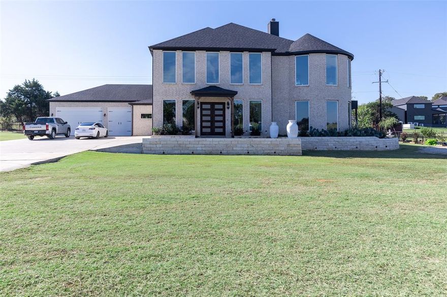 Where Luxury Meets the Land. Imagine a place where the air is crisp, the land fertile, and every sunrise feels like a private painting. This exquisite ranch estate offers absolute privacy, rich soil, and a thriving cattle operation — wrapped in the comfort of a 2022 on a serene 4-acre agricultural exempt estate. This custom-built residence is designed to impress. Inside, discover 5,690 square feet of modern elegance features a grand double staircase, 5 spacious bedrooms, 2.5 baths, a chef’s kitchen with professional-grade appliances. Floor to ceiling windows draw in natural lights, illuminating open-concept spaces that flow seamlessly to the outdoor living area with fully equipped kitchen. The primary suite is a masterclass in tranquility — featuring a spa-style bath, and a walk-in closet that blends luxury with practicality. Lush pastures, and endless views of open country. Enjoy modern comfort with ranch-style tranquility just 5 miles from Denton and minutes from Lake Lewisville, major retailers, and the PGA of America’s Frisco HQ. No City taxes, no HOA, and unmatched privacy. For those who dream of living beautifully and sustainably — this is your moment.